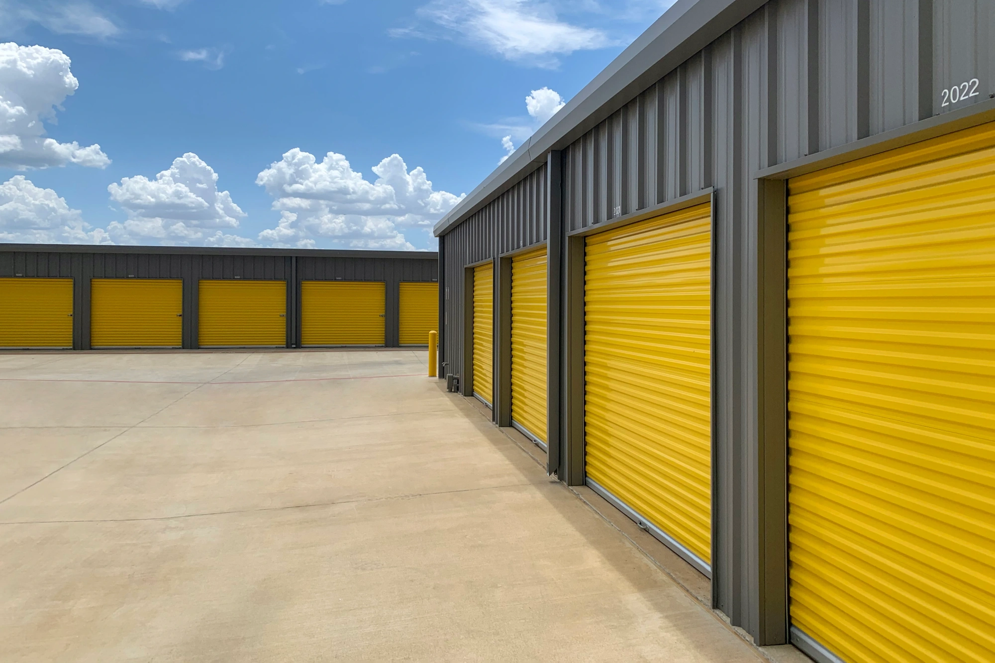 Storage facility with yellow rolling gates